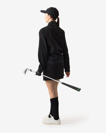 PERFORMANCE PLEATED SKIRT
