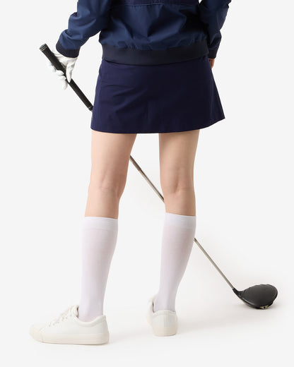 PERFORMANCE PLEATED SKIRT
