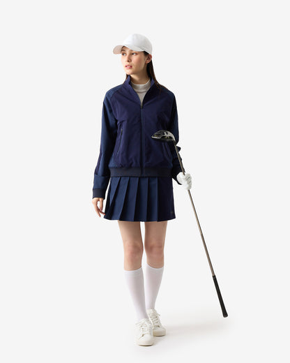 PERFORMANCE PLEATED SKIRT