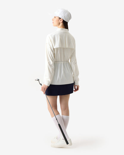 PERFORMANCE PLEATED SKIRT