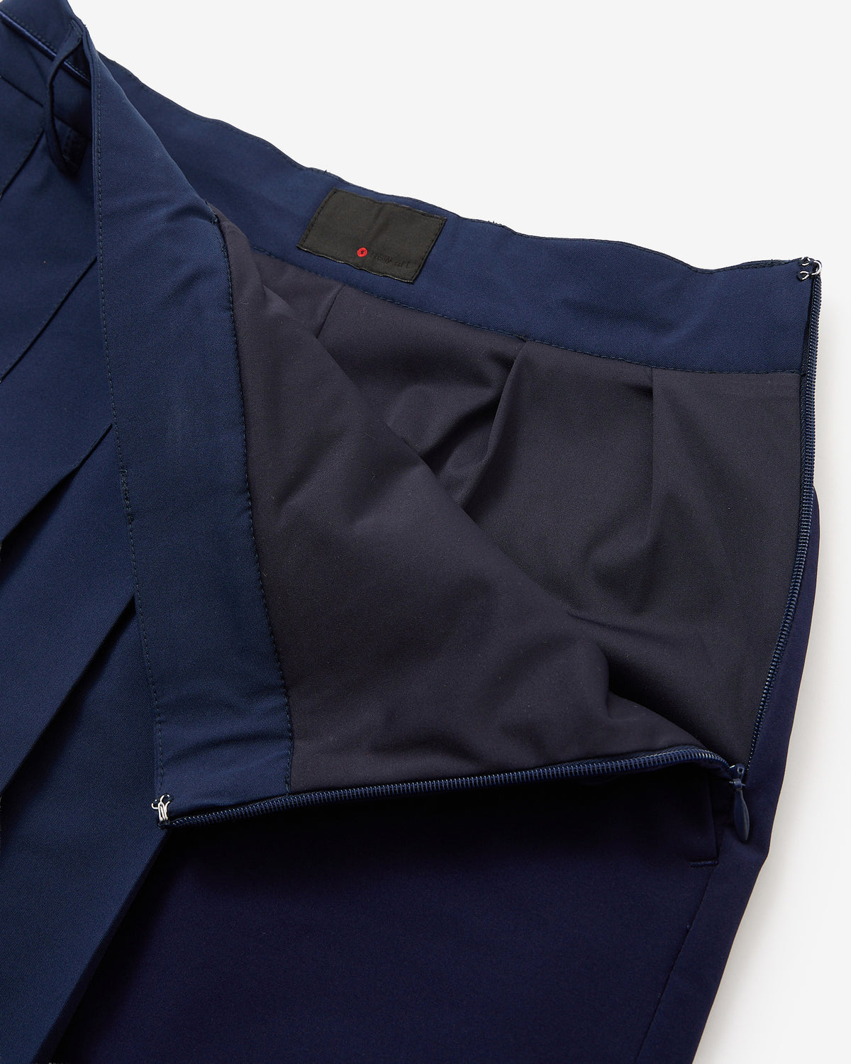 PERFORMANCE PLEATED SKIRT